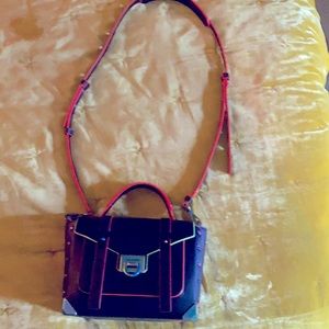 Michael Kors Mothschool purse. Used 3 times. Note: thin scratch on the back.